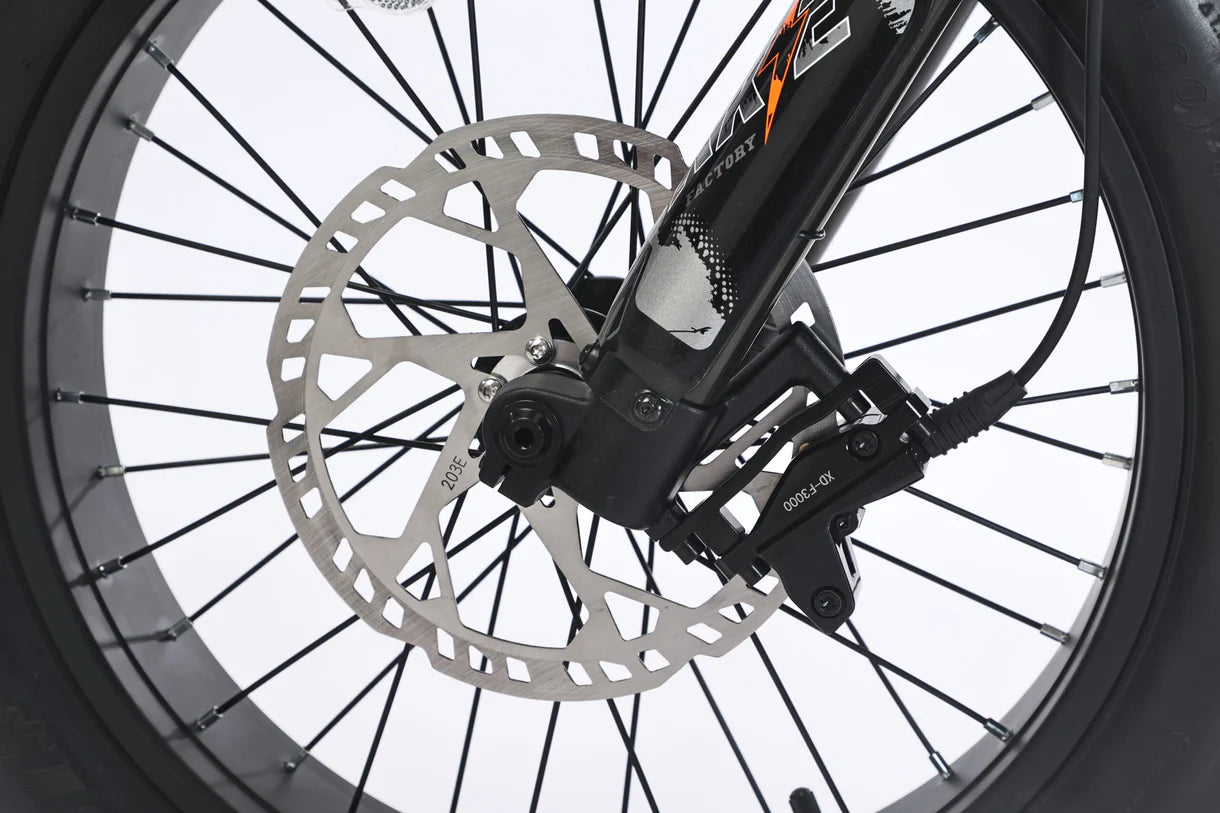 Close-up of GhostCat F4X Pro bike's hydraulic disc brake and wheel, showcasing superior stopping power and design.