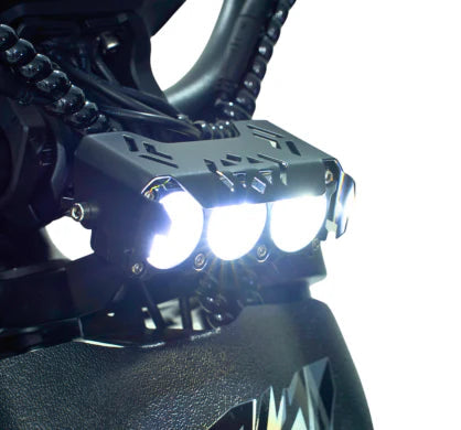 Close-up of Riding Times GT73 electric dirt bike's high-intensity LED headlights for enhanced visibility.