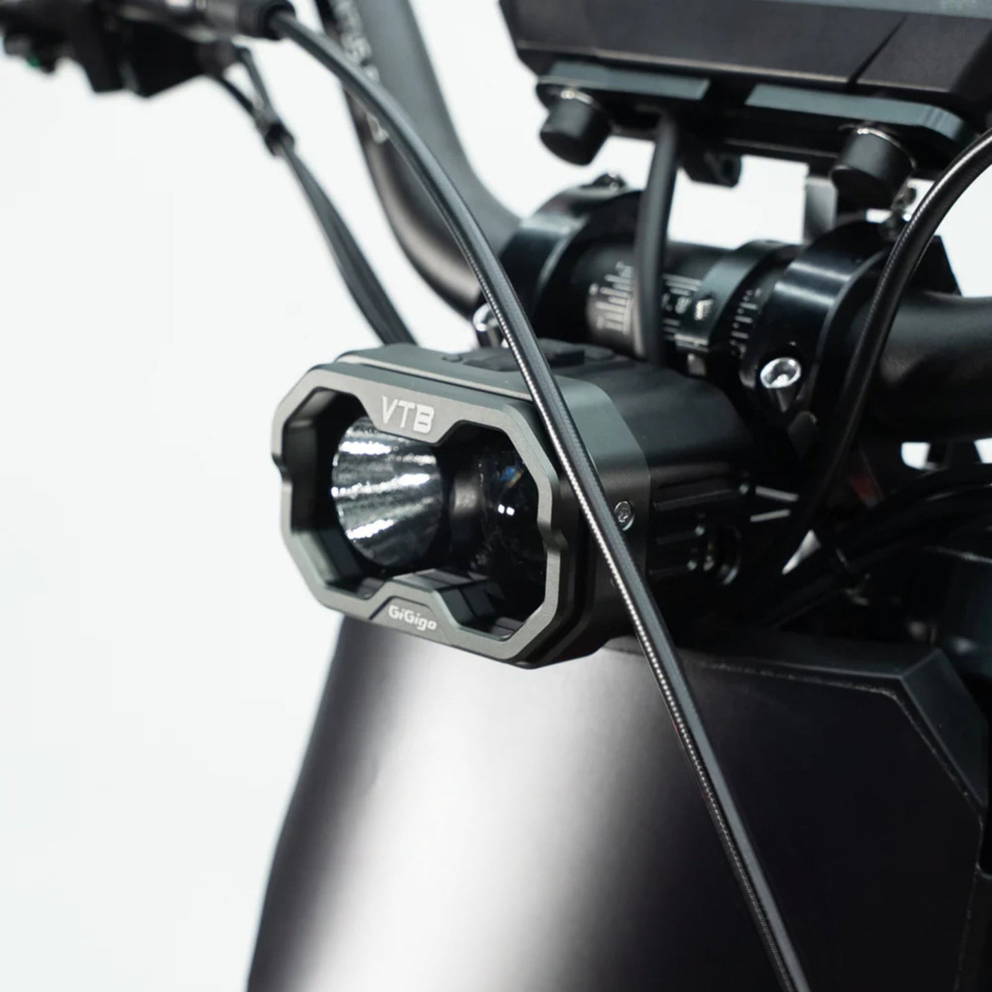 Close-up of the powerful VTB headlight on a Ventus V1+ electric dirt bike, showcasing advanced design and brightness.