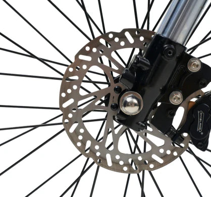 Close-up of the disc brake system on an electric dirt bike, showcasing precision engineering and safety features.