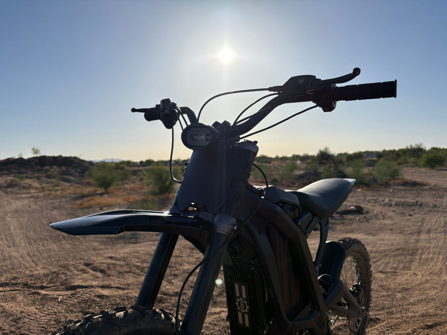 Natkie N1 Electric E Moto in Desert showing handlebars.