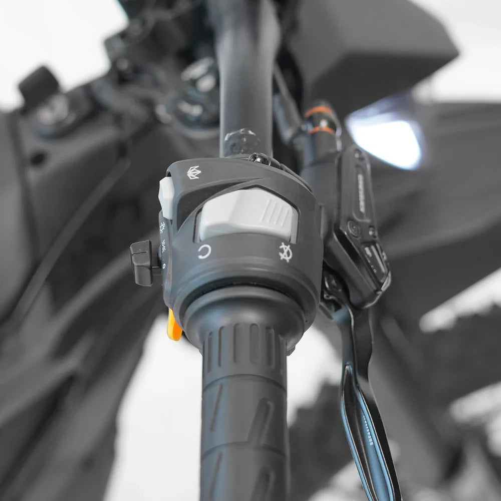 Close-up of the SRPNT 72V E-Moto throttle control, showcasing precision engineering and performance features.