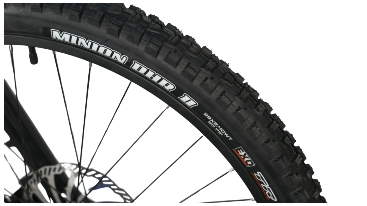 Close-up of a Minion DHR II mountain bike tire showcasing its tread design and sidewall.