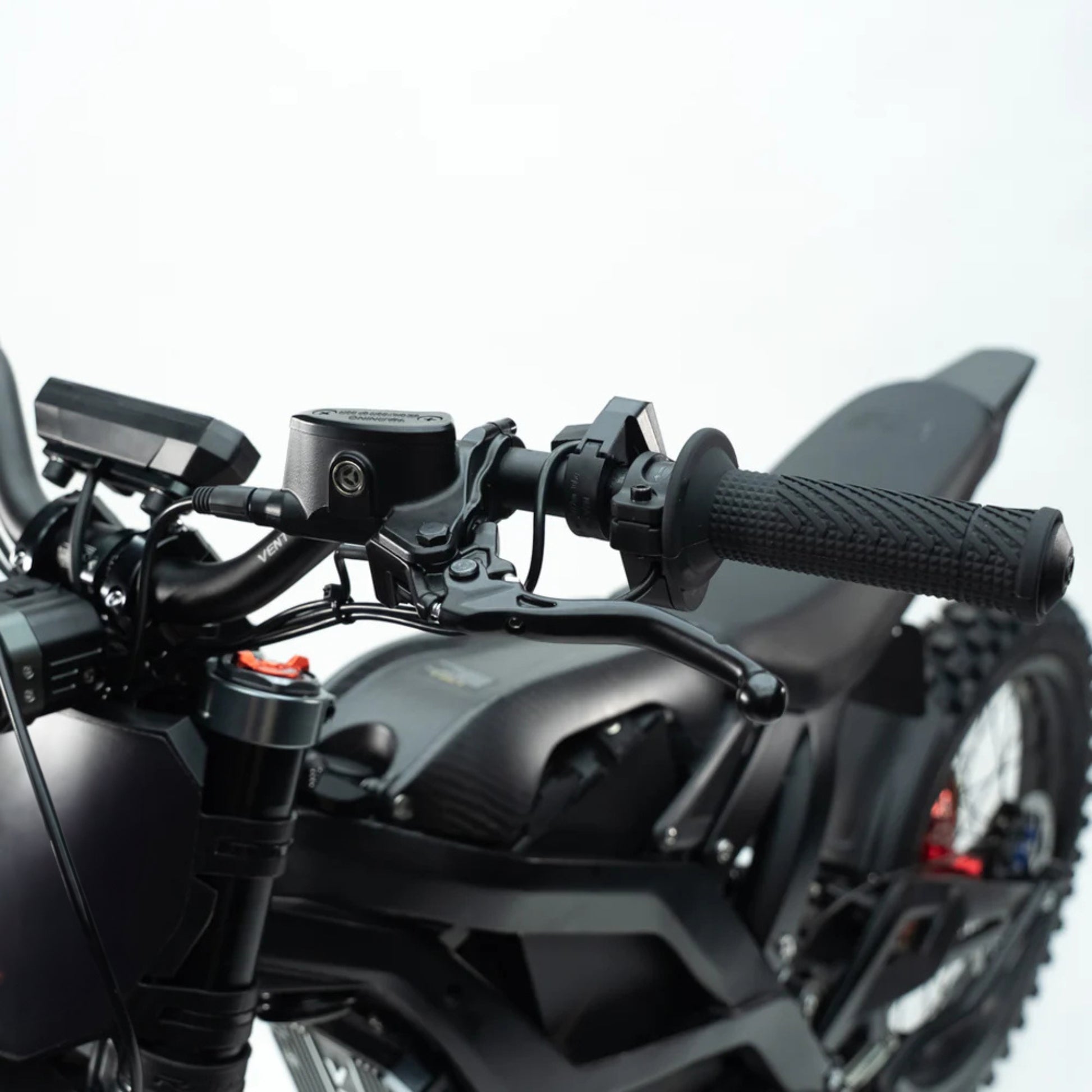 Close-up of the Ventus V1+ electric dirt bike handlebars showcasing controls and grips.