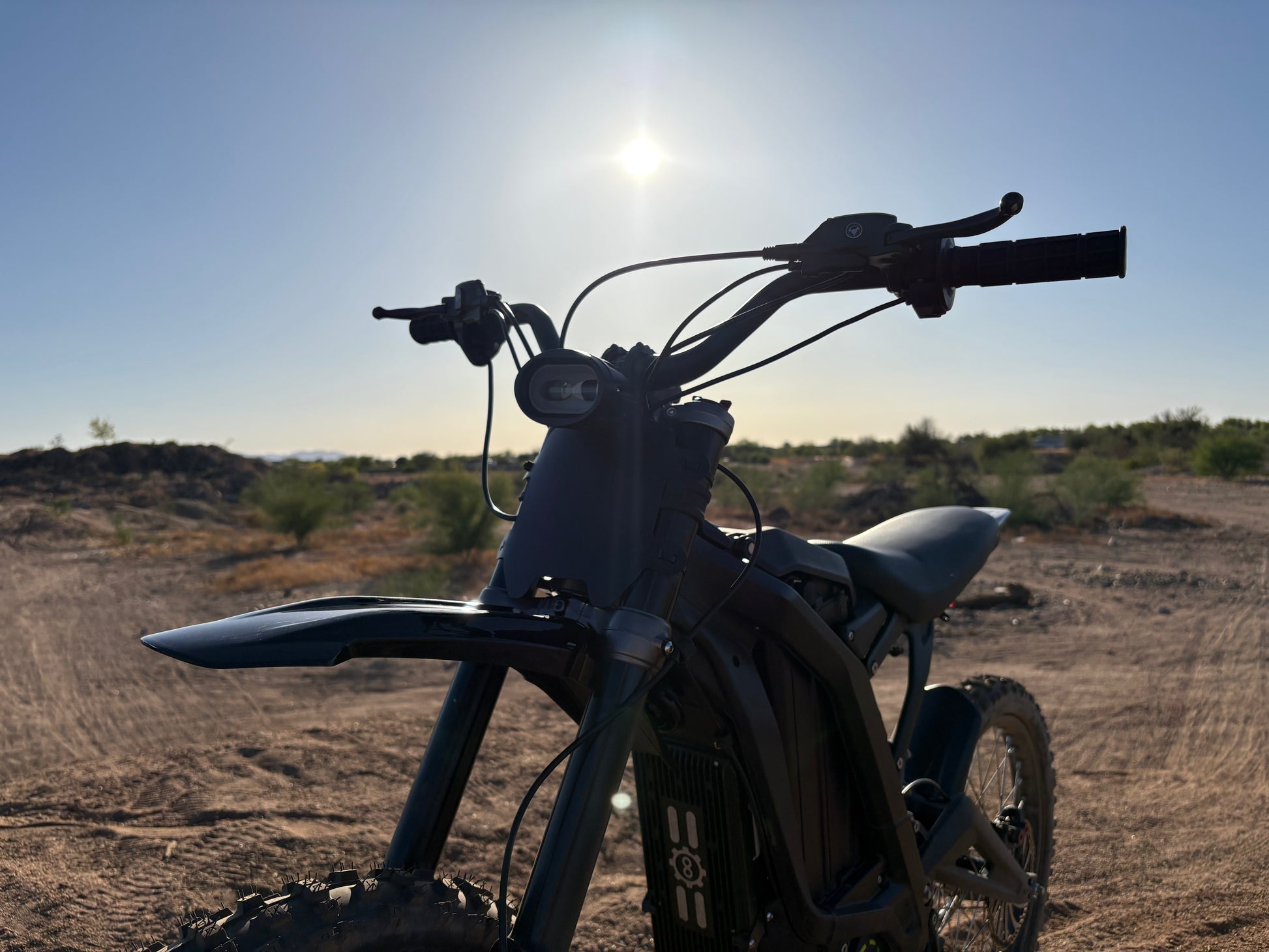 Natkie N1 Electric E Moto in Desert showing handlebars.