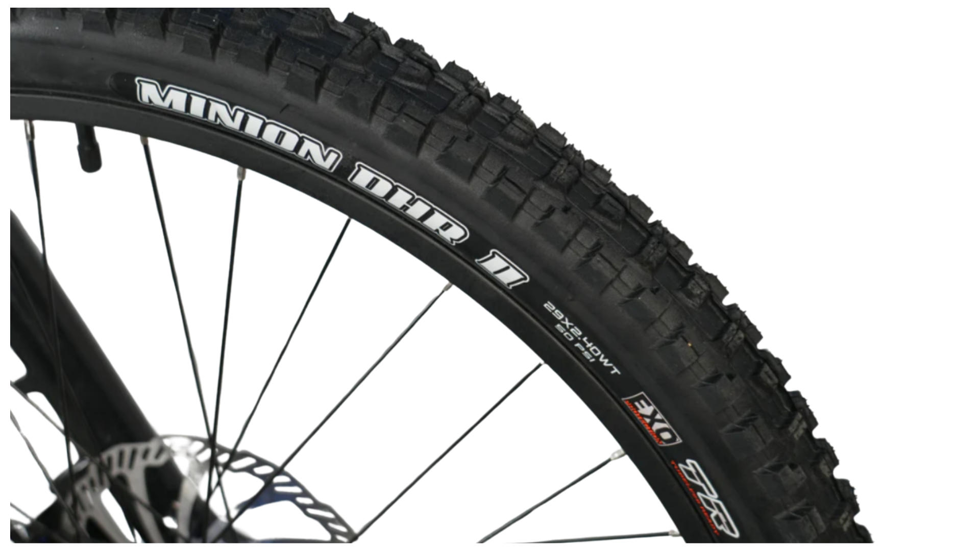 Close-up of a Minion DHR II mountain bike tire showcasing its tread design and sidewall.