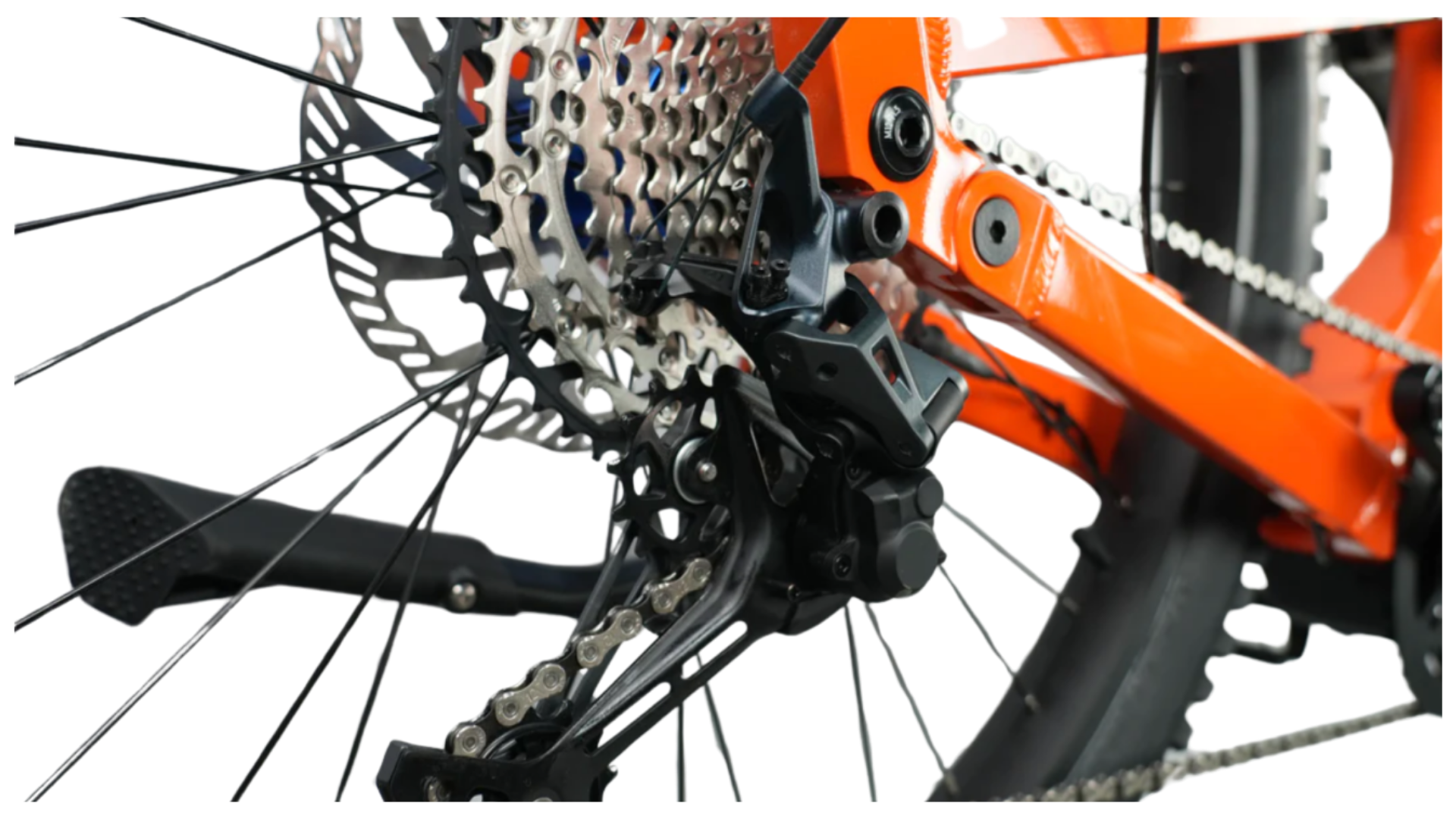 Close-up of the rear derailleur and cassette on the 2025 CyberBike Raptor Pro in Sunset Orange.